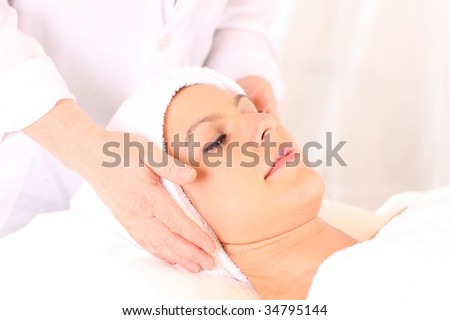 Facial treatment being applied in beauty clinic.