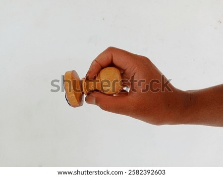 Similar – Image, Stock Photo Wooden stamp for hand printing patterns on fabric with paint. Printed fabric pattern