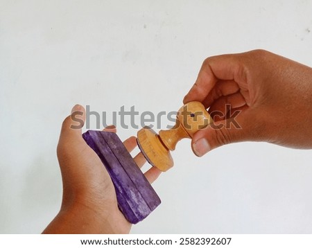 Similar – Image, Stock Photo Wooden stamp for hand printing patterns on fabric with paint. Printed fabric pattern