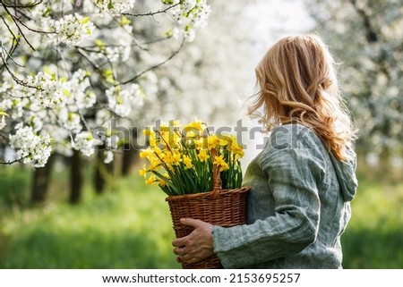 Image, Stock Photo Blonde woman with flowers on the countryside.