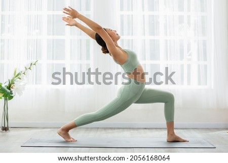 Similar – Image, Stock Photo Slim woman doing meditation on beach