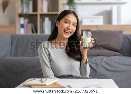 Similar – Image, Stock Photo Woman holding glass of water with reusable straw