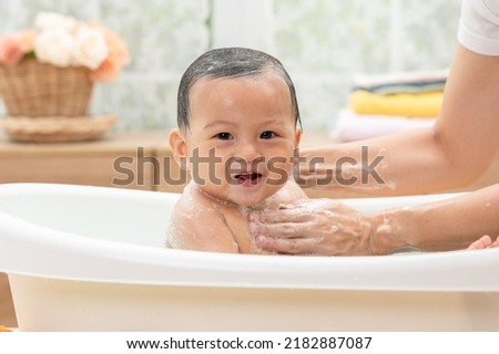 Similar – Foto Bild Mutter badet Baby zu Hause