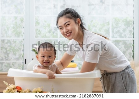 Similar – Foto Bild Mutter badet Baby zu Hause