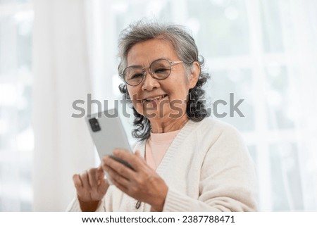 Similar – Image, Stock Photo Senior woman using mobile phone at home