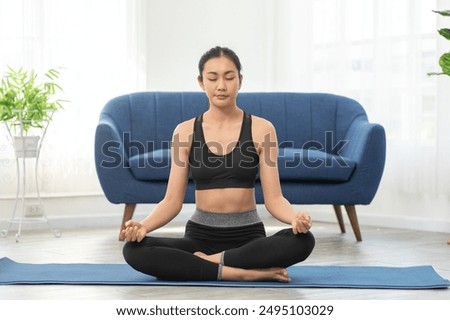 Similar – Image, Stock Photo Calm woman practicing yoga in Warrior position