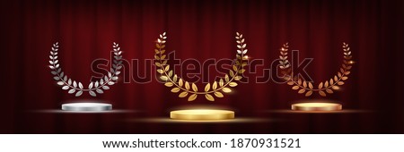 Golden, silver and bronze award signs with podiums laurel wreath isolated on red waving curtain background. Vector award design templates