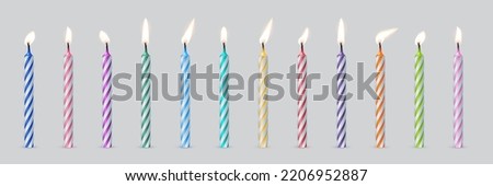 3d realistic striped colorful candles for birthday cake or pie vector illustration. Holiday candles with burning flames in night, candlelight on wicks, celebration objects on grey background