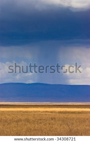 Landscape with rain and clouds in the distance