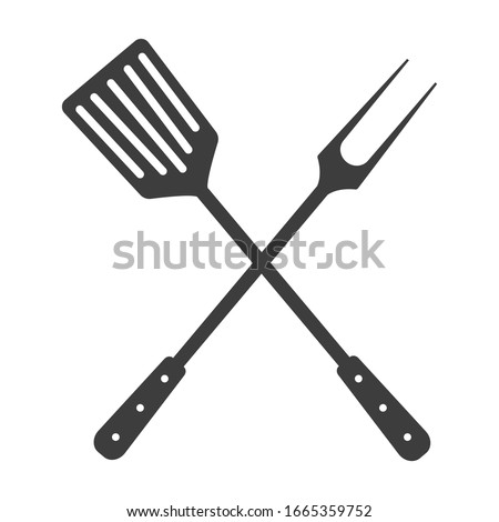 Grill tools icon. Crossed barbecue fork with spatula.  Isolated on white background.
