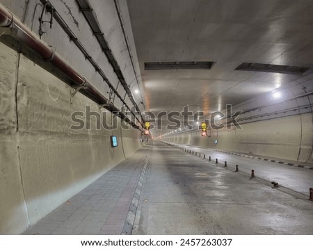 Similar – Image, Stock Photo Highway tunnel. Interior of urban tunnel without traffic in nught with blue lights. Rome, Italy