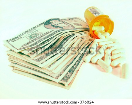 focus on pills with money and bottle in background suggesting rising cost of medication.