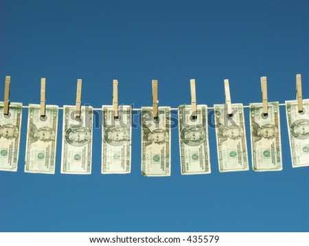 american twenty dollar bills hung on a clothesline.