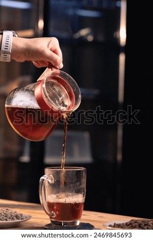 Similar – Image, Stock Photo Crop person pouring tea into bowl with herbs