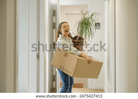 Similar – Image, Stock Photo Young female moving in new apartment