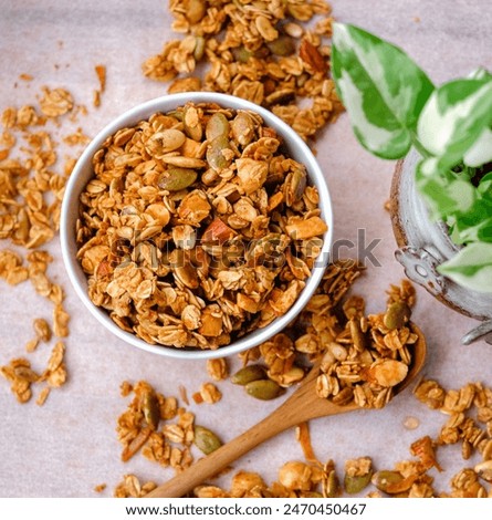 Similar – Image, Stock Photo Granola on a golden plate with a wooden spoon, rustic background