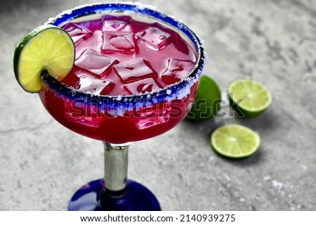 Prickly pear margarita over ice with lime garnish Сток-фото © 