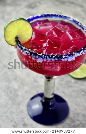 Prickly pear margarita over ice with lime garnish Сток-фото © 