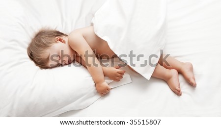 Baby sleeping in white sheets
