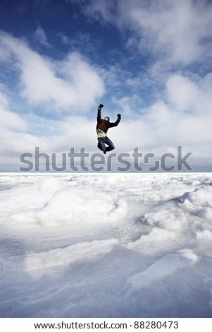 Man jumping in winter landscape