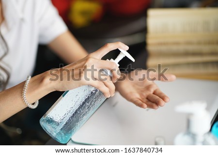 women washing hands with alcohol gel or antibacterial soap sanitizer after using a public restroom.Hygiene concept. prevent the spread of germs and bacteria and avoid infections corona virus           Stock foto © 