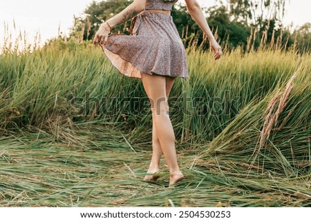 Similar – Image, Stock Photo Young female walking barefoot on wet sand