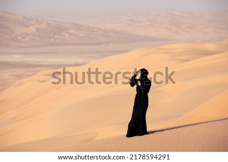 Similar – Image, Stock Photo Female tourist at wild rocky beach and coastline of surf spot La Santa Lanzarote, Canary Islands, Spain. La Santa village and volcano mountain in background