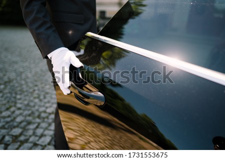 photo of a driver opening the car door ストックフォト © 