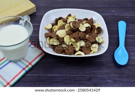 Similar – Foto Bild Frische Cornflakes, serviert mit Erdbeeren und Blaubeeren auf einem blauen Holztisch