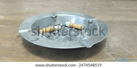 Image, Stock Photo Two cigarettes from above laying flat on pink and purple backgrounds as a symbol of female smoking