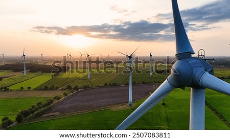 Image, Stock Photo Windmill at the lower edge of the picture in silhouette form and sky with contrails