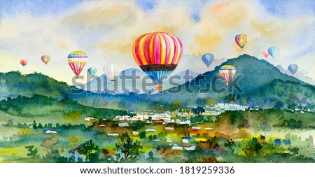 Watercolor landscape painting colorful of hot air balloon on village, mountain in the Panorama view and rural society, nature spring in sky background. Hand painted abstract illustration in Asia.