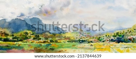Watercolor landscape original paintings on paper colorful of Village cottage, rice field, farmer farm with mountain and sky, cloud background. Hand painted beauty nature autumn season in Thailand.
