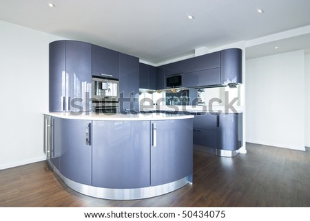 Ultra modern designer kitchen with modern appliances in metal blue and gray