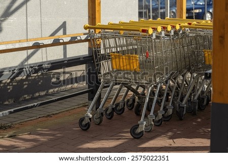 Similar – Image, Stock Photo Shopping carts arranged in the parking and entrance area of a giant warehouse supermarket, on the outskirts of Zaragoza city, Spain.