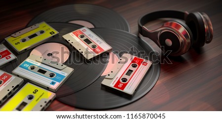 1970s-1980s party music. Vintage audio cassettes, vinyl records and dj headphones, wooden background. 3d illustration