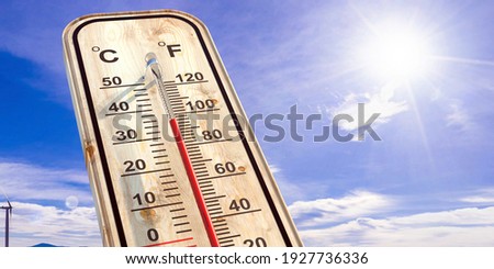 Summer heat, high temperature outdoors, hot desert weather. Thermometer reaching 100 degrees Fahrenheit scale on blue sky background, sunny day. 3d illustration