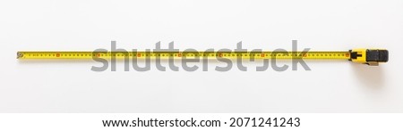 Measure Tape isolated on white background. Metal meter long yellow color, construction hand tool top view, banner.  Photo stock © 