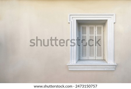 Image, Stock Photo old closed shutters with flaking white lacquer and rusty hinges in brick facade with partly missing plaster that have seen better days ;old