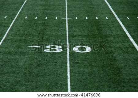 View of thirty yard line on an artificial turf football field