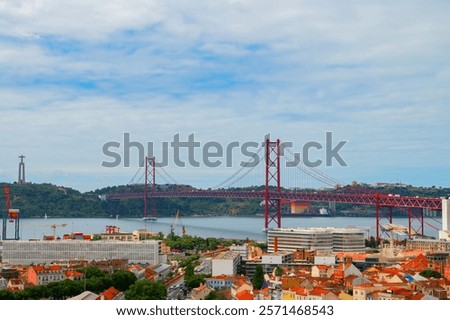 Similar – Foto Bild Die berühmte Brücke Ponte 25 de Abril in Lissabon, Portugal, im Hintergrund einer ruhigen Straße