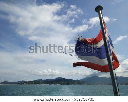 Thailand flag behide on the both and blue sky. see Phra Ngan Island,south of Thailand