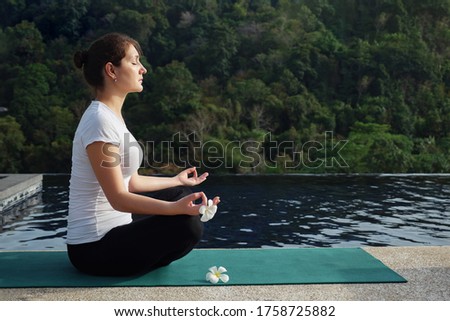 Similar – Image, Stock Photo Woman meditating near tropical bush