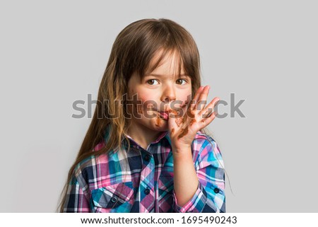 Similar – Image, Stock Photo Little girl with dirty and sad face. She is going to burst out crying that her favourite food is over