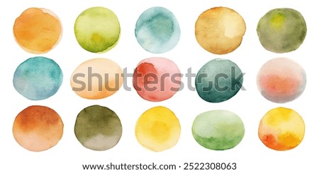 A series of watercolor circles in various shades of green, yellow, and orange. The circles are arranged in a grid, with some overlapping and others standing alone. Scene is one of creativity