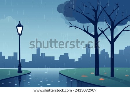 City park in rainy weather. Rain in the park. Pedestrian road with puddles, rain splashes and reflections against the background of green grass, a lantern, a tree and silhouettes of buildings.