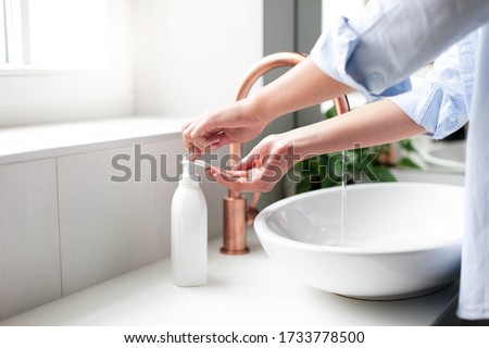 Similar – Image, Stock Photo unrecognizable woman washing hands on a sink with soap. Coronavirus covid-19 concept