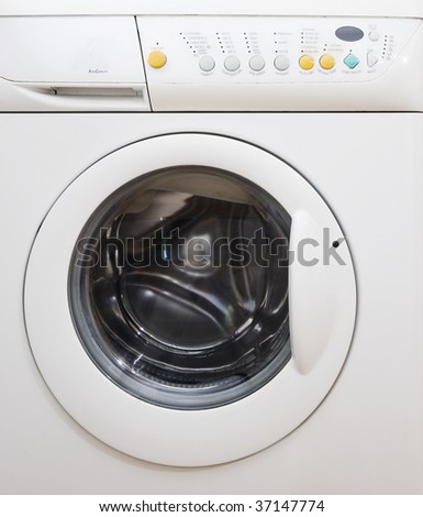 white drum washing machine with dials and opening on front