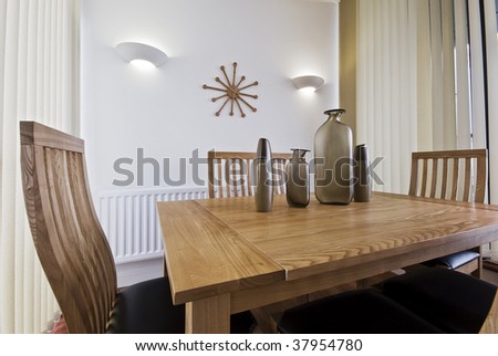 contemporary dining room with sitting for six people and decorative elements