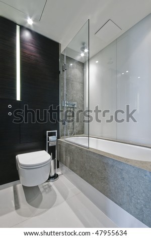 luxury bathroom with marble tiles and hard wood elements